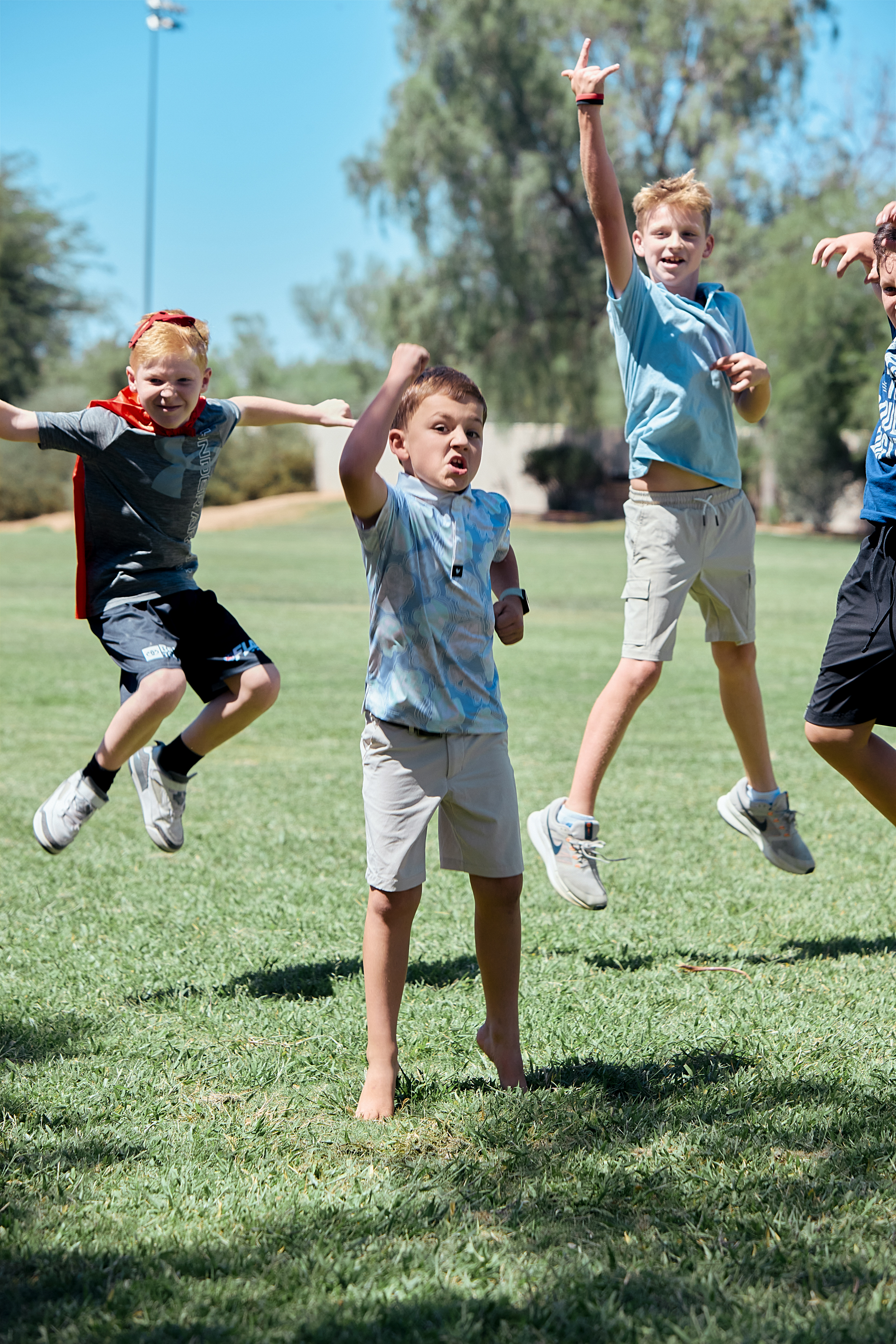 Happy kids jumping in the summer
